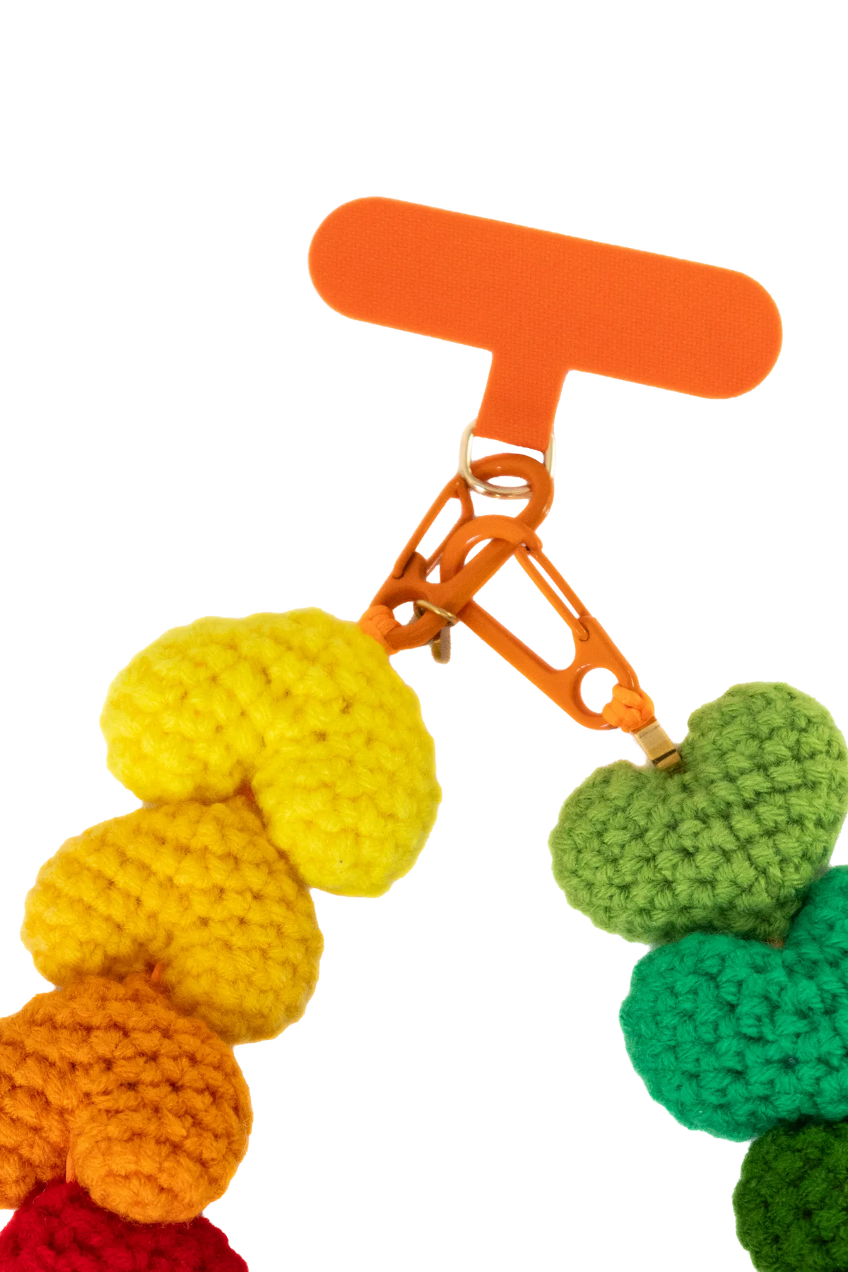 Close-up of the orange tab, clasp and cotton crochet hearts
